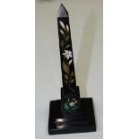 A Derbyshire Ahford marble obelisk, inlaid in malachite and specimen stones with lilies,