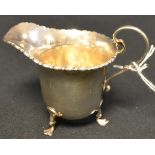 A silver cream jug,