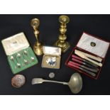 A set six silver teaspoons retailed by Harrods,