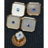 A pair of mother of pearl effect and pale blue stone possible spinel inset 9ct gold cufflinks and