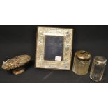 A silver children's photograph frame, Sheffield 1986; a dressing table jar, silver top,