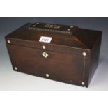 An early 19th century mahogany sarcophagus tea caddy, mother of pearl inlaid,