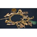An 18ct gold curb link charm bracelet, suspending seventeen silver,