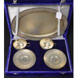 A pair of sterling silver tea cups and saucers on tray, marked 925,