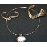 A Modernist silver bangle; another,