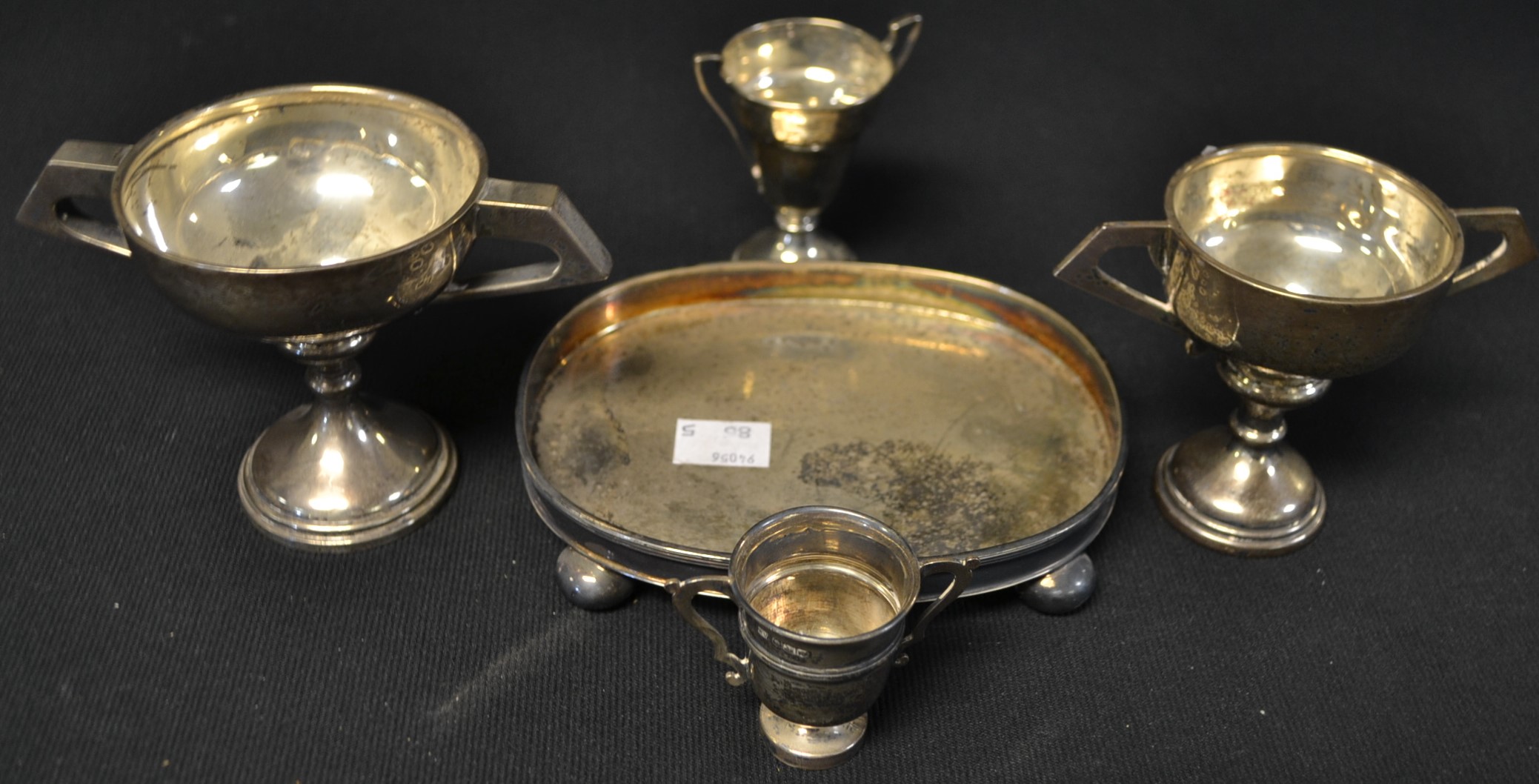 A silver trophy, Birmingham 1938; other silver trophies, all hallmarked; a silver oval tray,