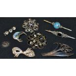 Jewellery - a silver kiwi brooch; an enamel and mother of pearl flower brooch; another,