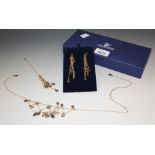 A Swarovski crystal woven lattice fringe necklace, similar droplet pendant and earrings suite,