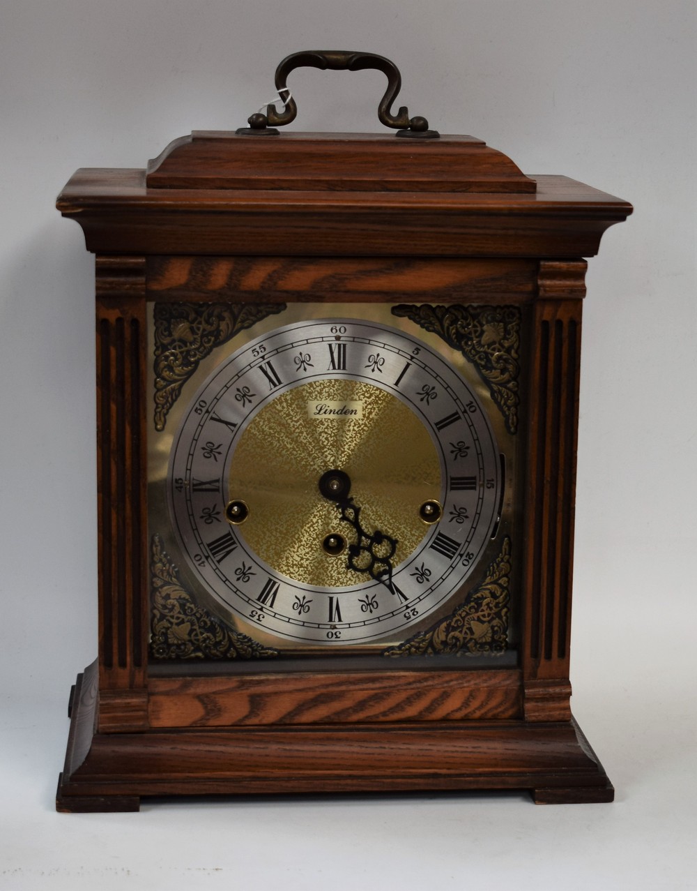 A 20th century American light oak cased Westminster chiming bracket clock, by Linden, brass dial,