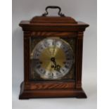 A 20th century American light oak cased Westminster chiming bracket clock, by Linden, brass dial,