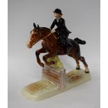 A Beswick figure group, Lady Rider on horseback, riding side saddle taking a fence, 27.