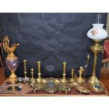 A brass Duplex twin burner oil lamp; a 'gilt' metal and pink glass decorative ewer;