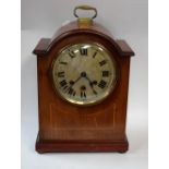 An Edwardian mahogany inlaid bracket clock, circular face with Roman numerals, minute track,