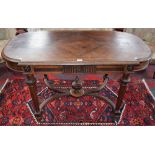 A 19th century bowed rectangular library table,