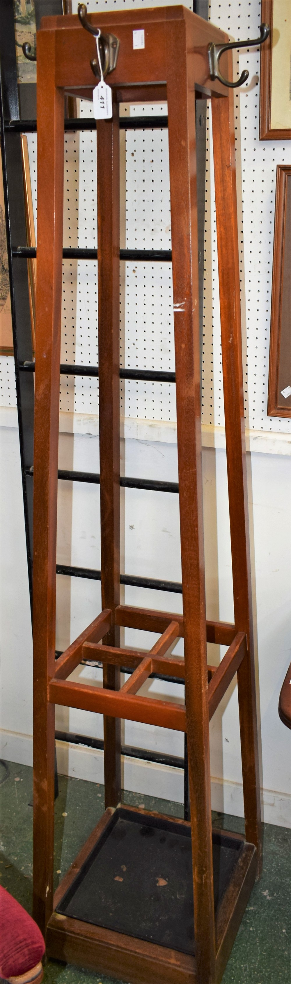 A mahogany coat/stick stand