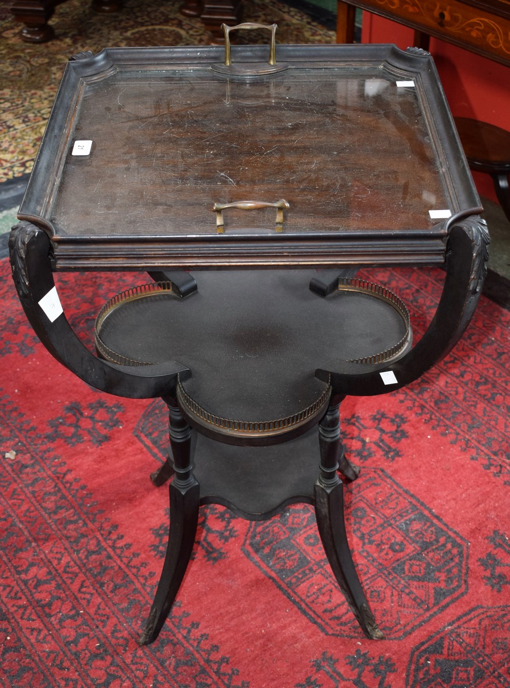 A Louis XVI style ebonised occasional table,