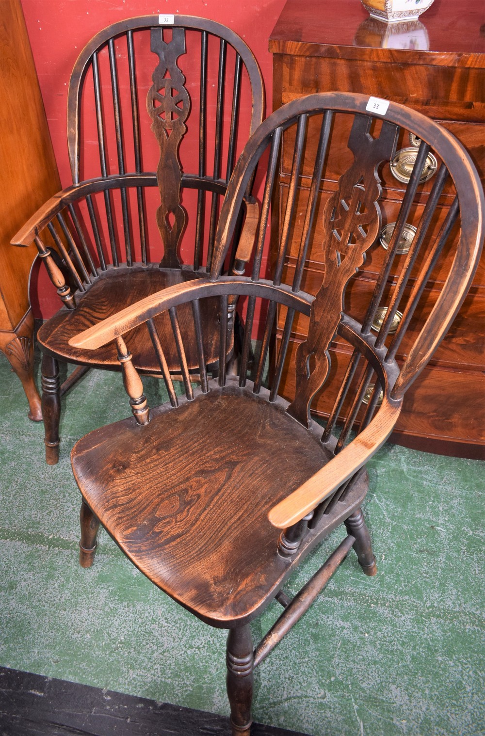 A pair of Country kitchen Windsor elbow chairs,