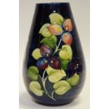 A Moorcroft Trillium pattern vase, blue ground,