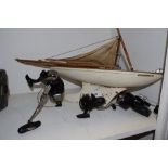 A scratch built yacht model of Endeavour IV; a Geologic FD65-7 fishing reel;