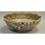 A Charlotte Rhead Crown Ducal fruit bowl, pattern no 5983, tubelined with abstract flowers,