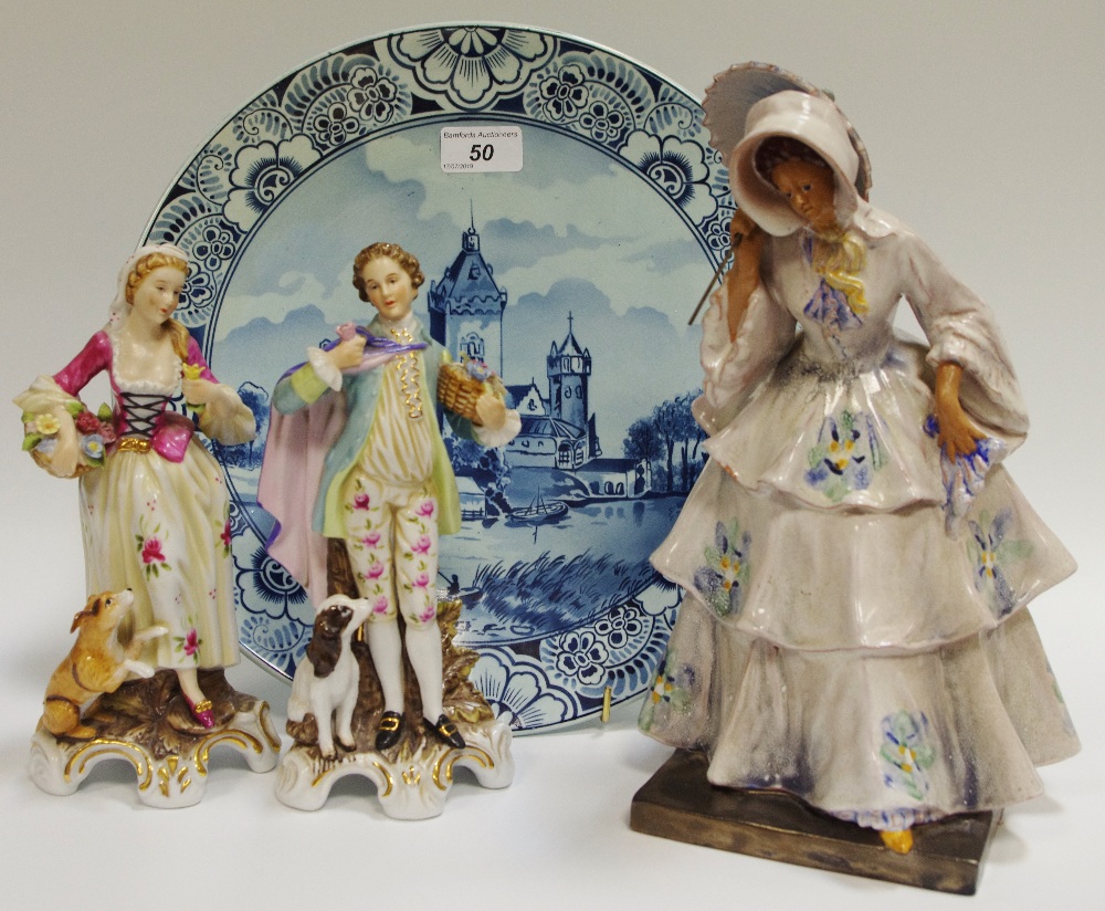 A 19th century plate decorated with river scene gallant and girl along with a figure of a lady