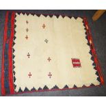 A hand woven Kilim Sofreh throw rug, in hues of burnt sienna,