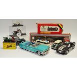 A Danbury Mint Chevrolet Impala; A Road Signature Ford Mustang GT500; a Welly VW Type Kombi van;