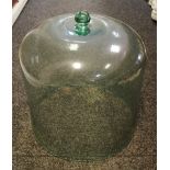 A clear glass vegetable cloche,