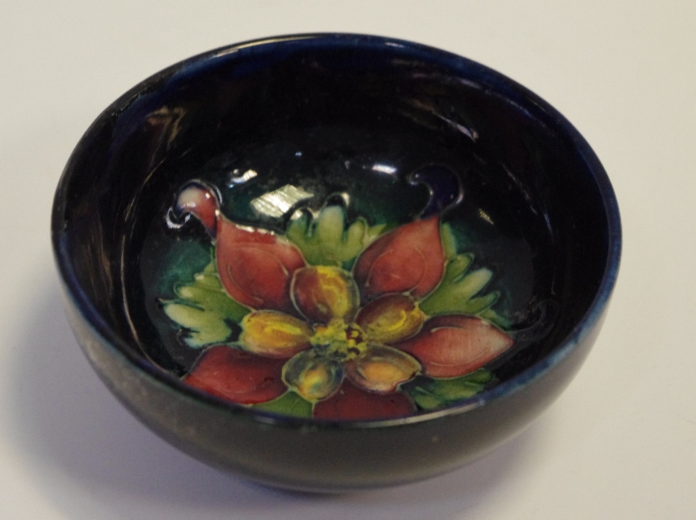 A small Moorcroft bowl, Columbine pattern 8cm diameter.