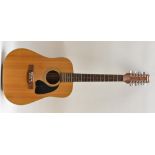 A Marina Acoustic twelve string Dreadnought Guitar, spruce soundboard, mahogany sides and back.