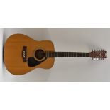 A Yamaha FG-412-12, twelve string, acoustic guitar. length of soundboard 50.