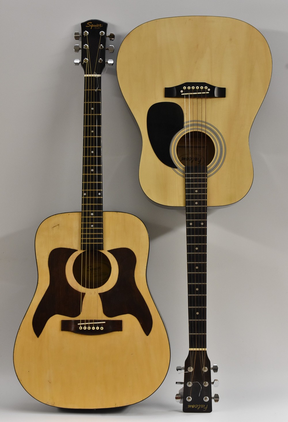 A Squier six string acoustic guitar by Fender, model no.