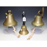 A brass ships bulkhead bell; another similar;