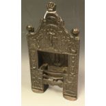 A Victorian cast iron miniature ornate fire place/chimney piece, cast motifs,