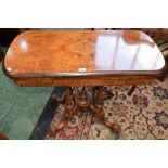 A Victorian walnut and marquetry card table, rounded rectangular top inlaid with flowerheads,