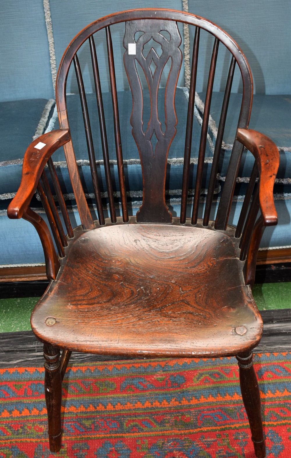 A Country house Windsor chair, pierced splat, serpentine arms, curved arm posts, elm seat,