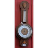An Art Deco oak cased banjo wall barometer,