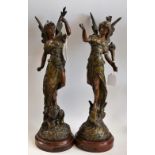 A pair of late 19th century French brown patinated spelter sculptures of La Paix and La Fortune,