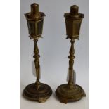 A pair of gilt metal novelty table lighters, as lamp posts,