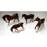 A Beswick model, of a prancing bay horse; others, similar, standing and with head down,