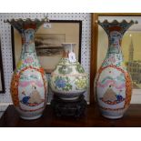 A pair of Japanese side vases, decorated in polychrome with peacock and figures, flared wavy necks,