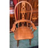 A Country kitchen Windsor type elbow chair, central wheelback splat,