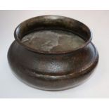 A Middle Eastern bronzed flared bowl, chased with Islamic calligraphy, foliage and motifs,