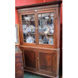 A 19th century oak corner display cabinet,