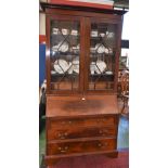 A George III style mahogany bureau bookcase,