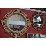 A Baroque style gilt and cream painted looking glass;