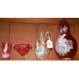 A large Victorian cranberry glass jug, in the manner of Mary Gregory,
