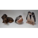 A Royal Copenhagen model, of a puppy, number 3140; others, similar, penguin group, 1190 and bird,