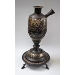 A Middle Eastern white metal dascened bronze hookah base,