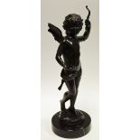 A cast bronze figure of Cupid on a circular marble base,